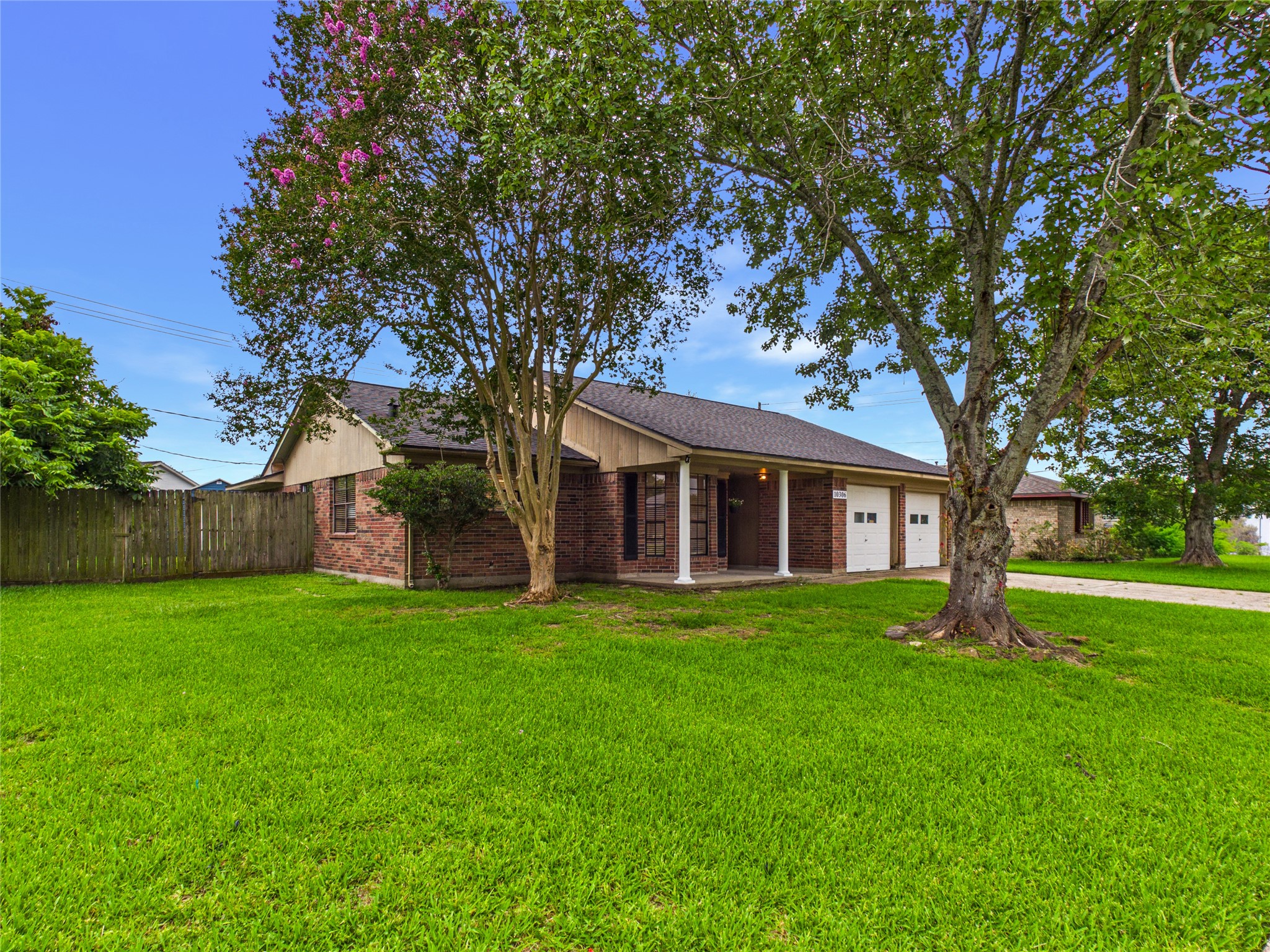 10306 Rustic Rock Road La Porte, TX 77571 - Photo 2 of 38 a front view of a house with a garden