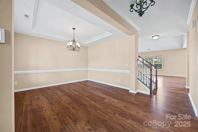 a view of an entryway with wooden floor