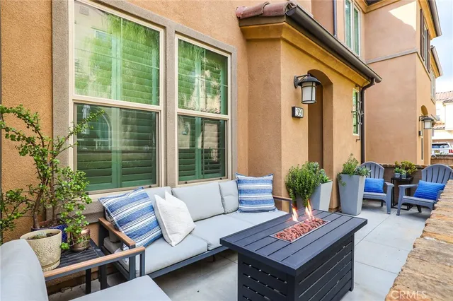 a outdoor living space with furniture and a potted plant