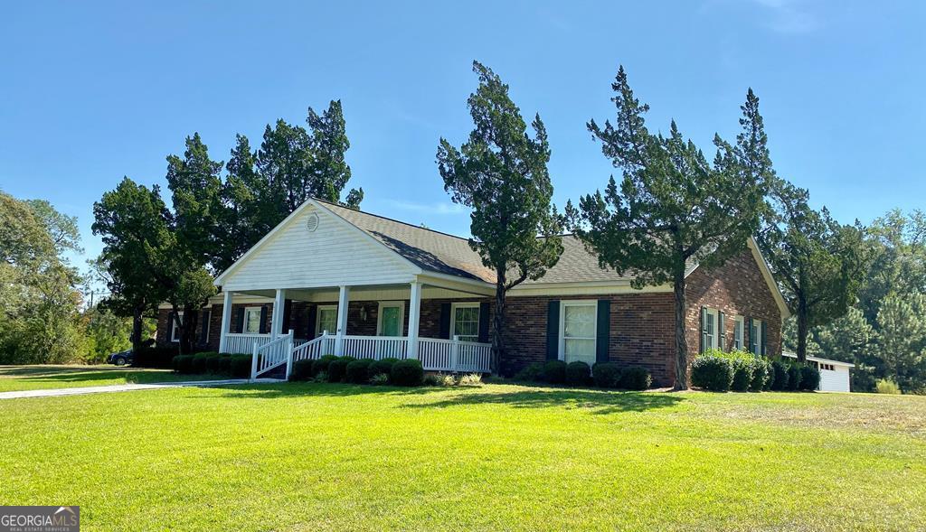 60 Reagin Road Hazlehurst, GA 31539 - Photo 1 of 1 a front view of a house with a garden