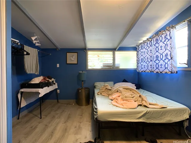 a bedroom with a bed and a table