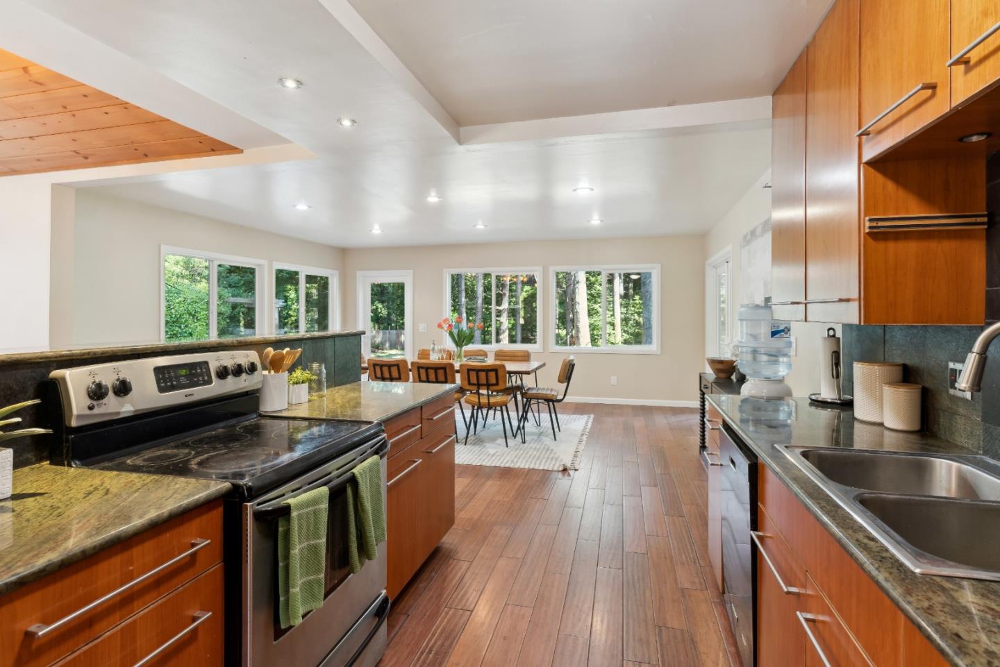 1850 Pine Flat Road Santa Cruz, CA 95060 - Photo 16 of 62 a kitchen with stainless steel appliances granite countertop a lot of counter space and wooden floors