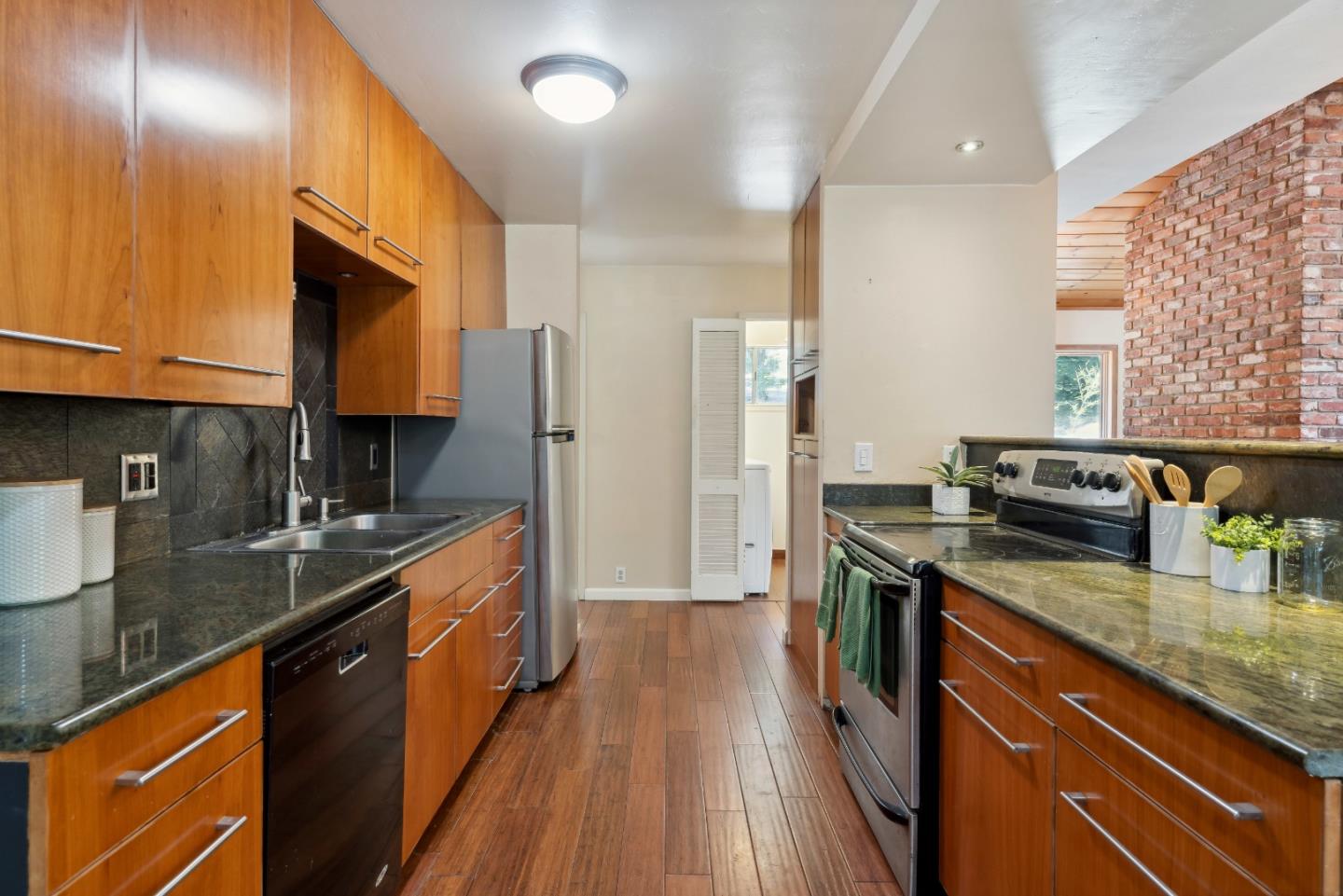 1850 Pine Flat Road Santa Cruz, CA 95060 - Photo 17 of 62 a kitchen with stainless steel appliances granite countertop sink stove top oven and refrigerator
