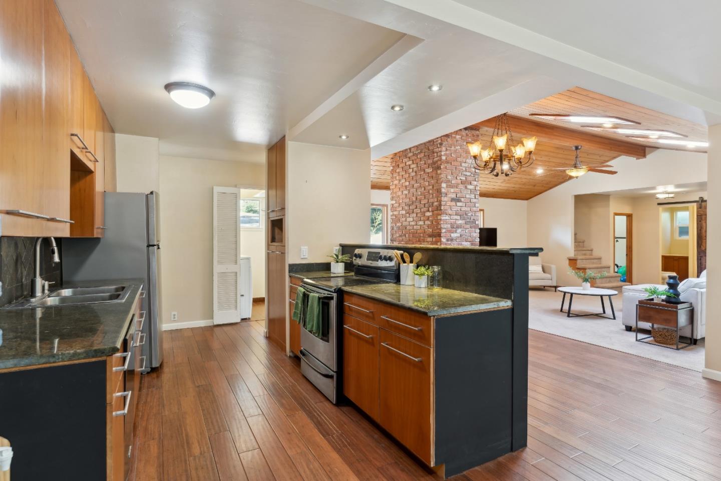 1850 Pine Flat Road Santa Cruz, CA 95060 - Photo 18 of 62 a kitchen with stainless steel appliances granite countertop wooden floors and view living room