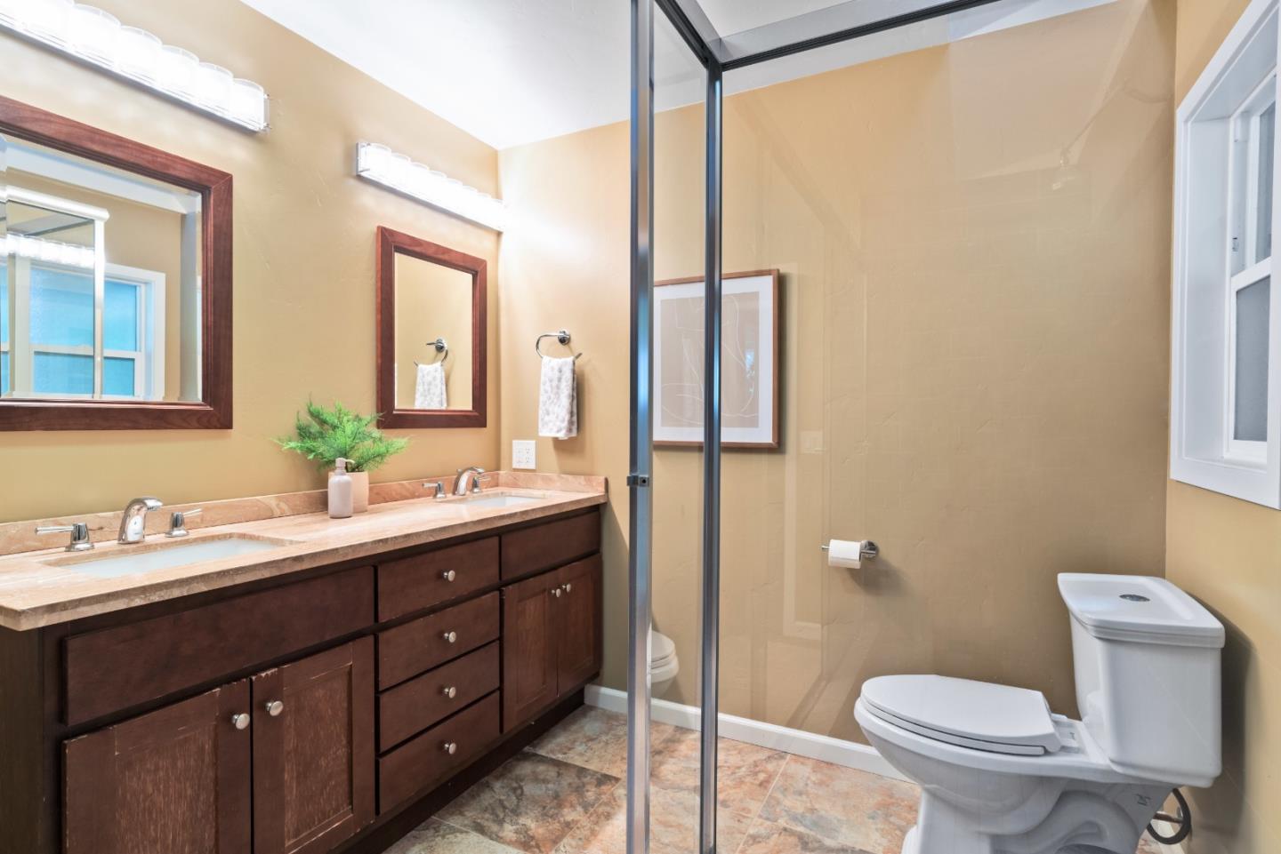 1850 Pine Flat Road Santa Cruz, CA 95060 - Photo 25 of 62 a bathroom with a double vanity sink toilet and mirror