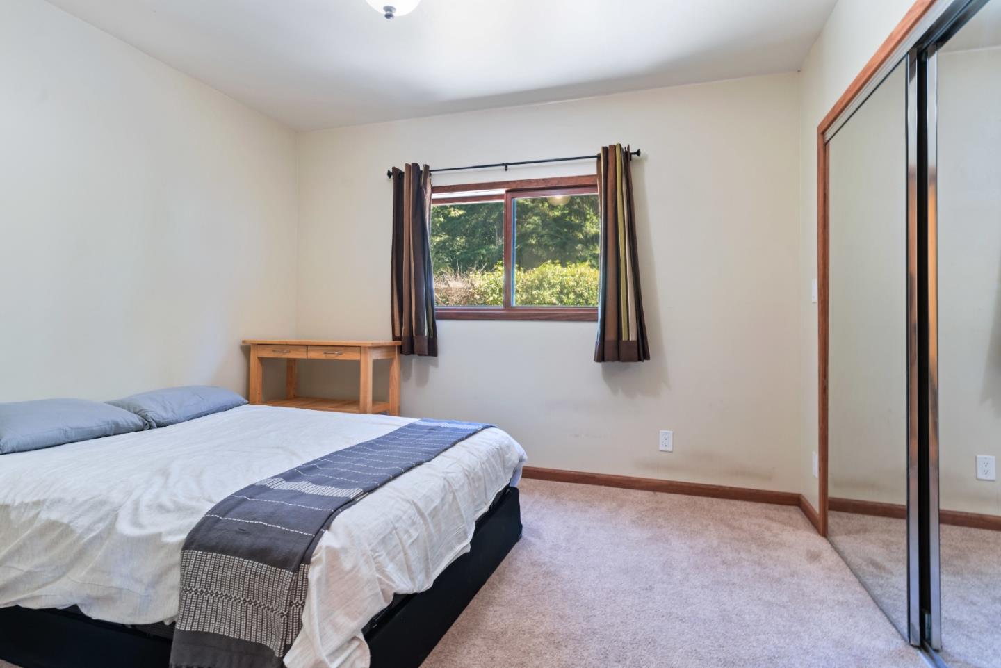1850 Pine Flat Road Santa Cruz, CA 95060 - Photo 28 of 62 a bedroom with a bed and a window