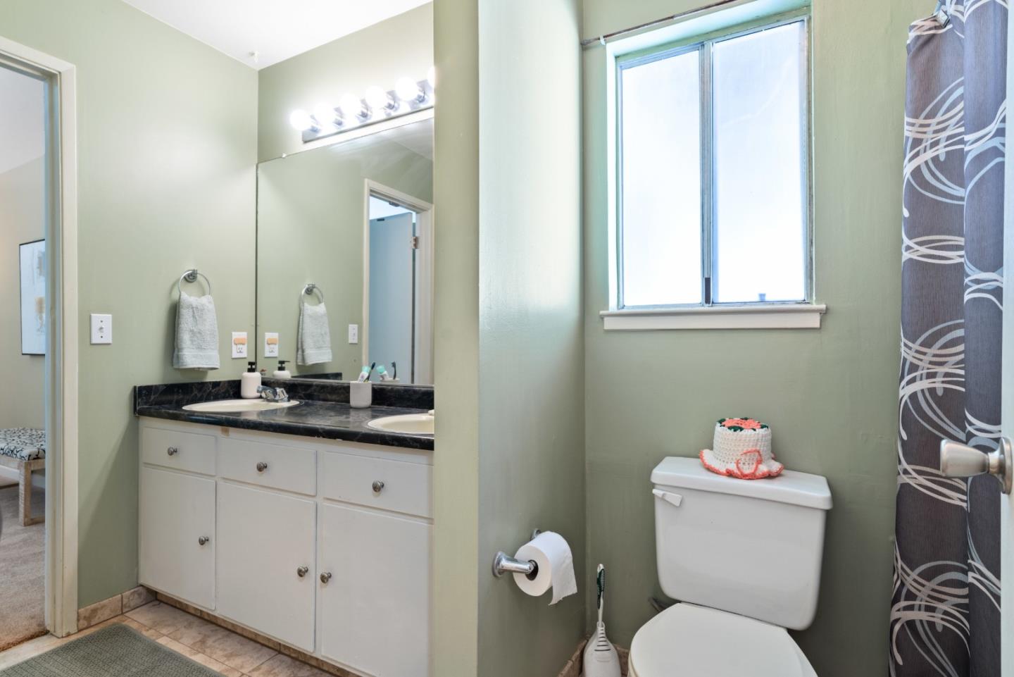 1850 Pine Flat Road Santa Cruz, CA 95060 - Photo 29 of 62 a bathroom with a granite countertop toilet sink and mirror