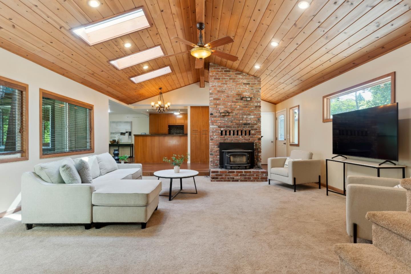 1850 Pine Flat Road Santa Cruz, CA 95060 - Photo 3 of 62 a living room with furniture and a flat screen tv