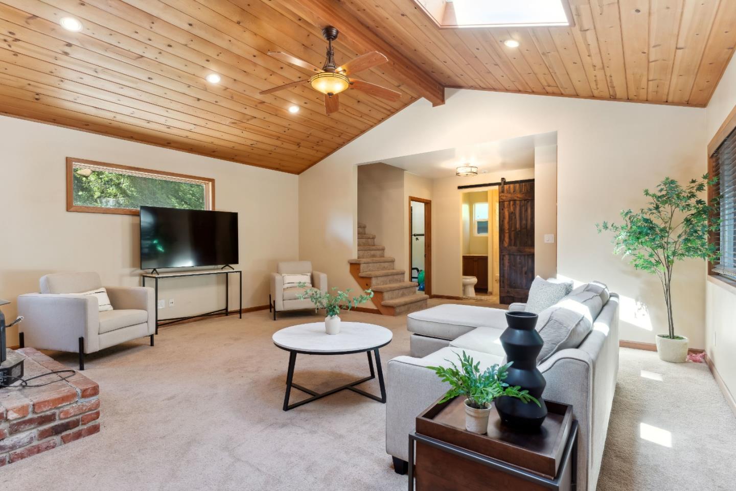 1850 Pine Flat Road Santa Cruz, CA 95060 - Photo 6 of 62 a living room with furniture and a flat screen tv