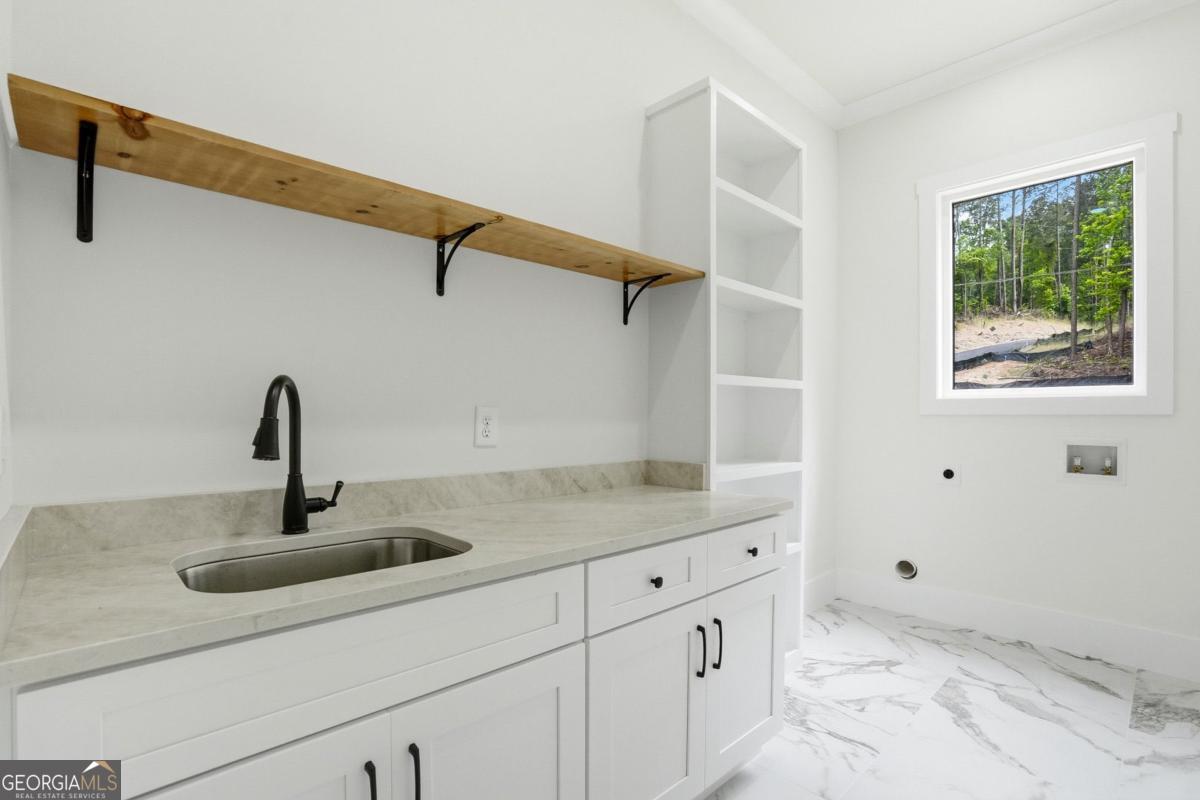 1557 Whitley Road Dacula, GA 30019 - Photo 36 of 46 a close view of a sink and a vanity in the bathroom