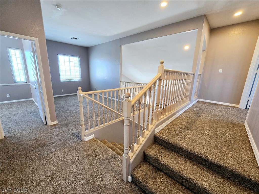3759 Funston Way Las Vegas, NV 89129 - Photo 12 of 31 A split-level landing provides an airy transition between living spaces.