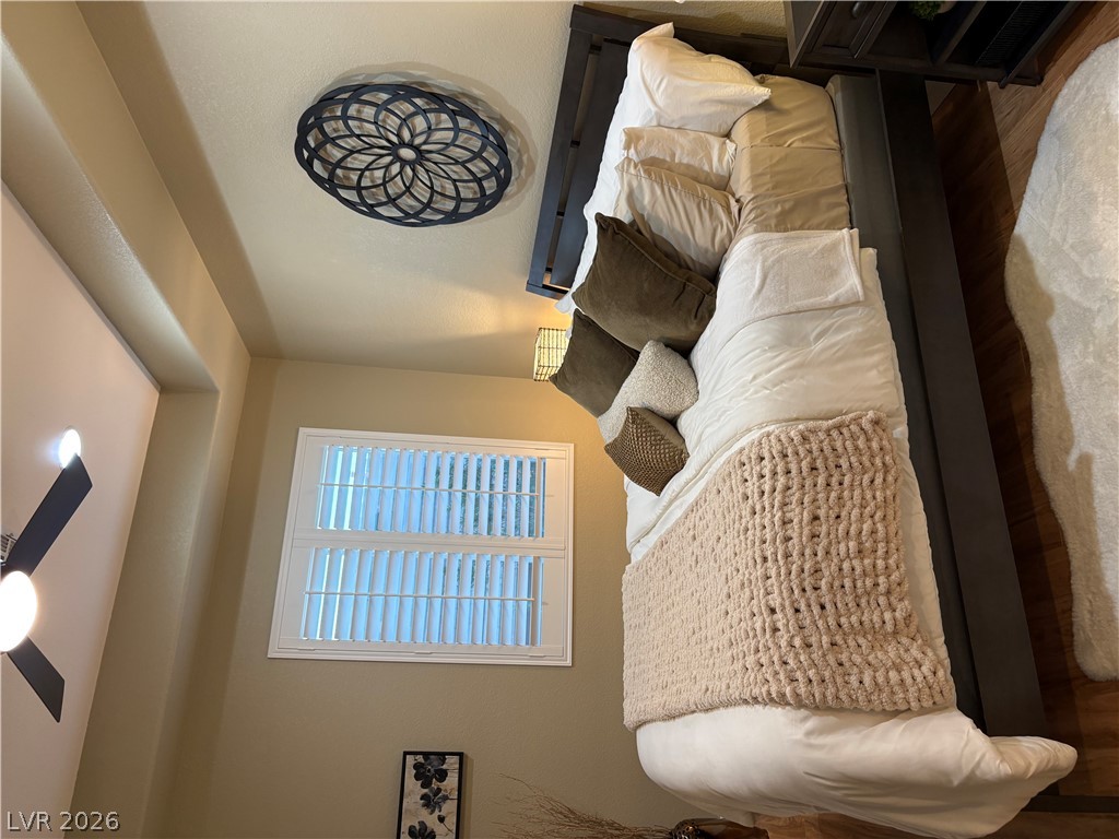 977 Rhyolite Terrace Henderson, NV 89011 - Photo 23 of 33 Rich wood flooring and a recessed ceiling alcove define this peaceful sleeping space.