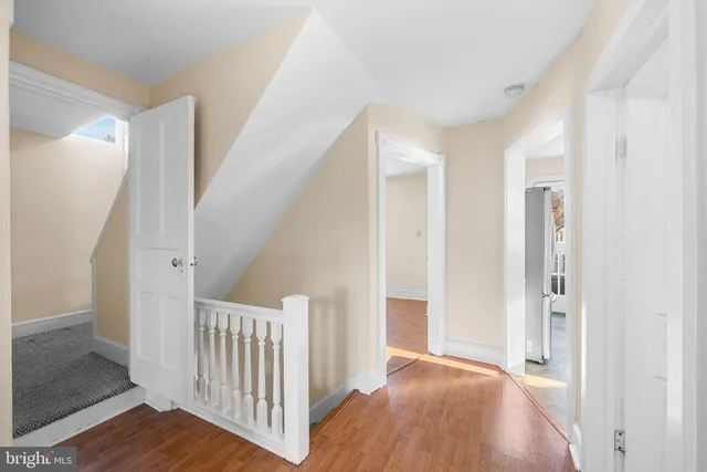 a view of a room with wooden floor and stairs
