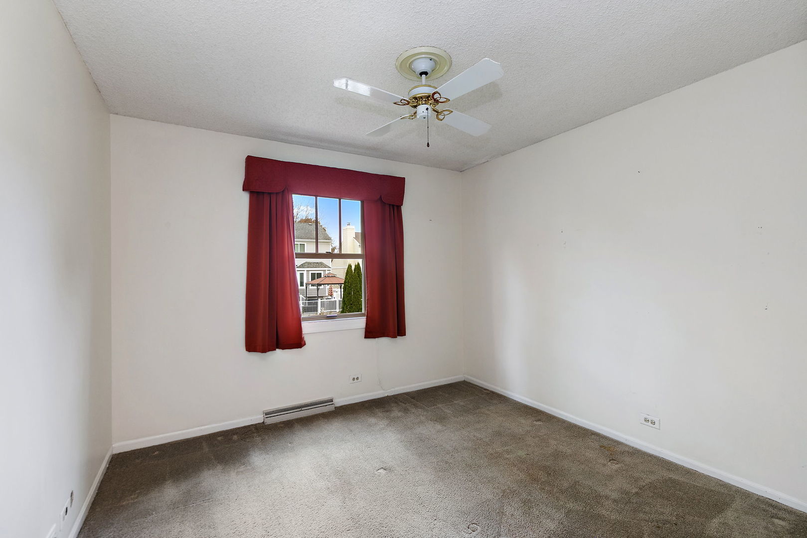 517 Sheffield Road Naperville, IL 60565 - Photo 13 of 29 an empty room with windows and fan