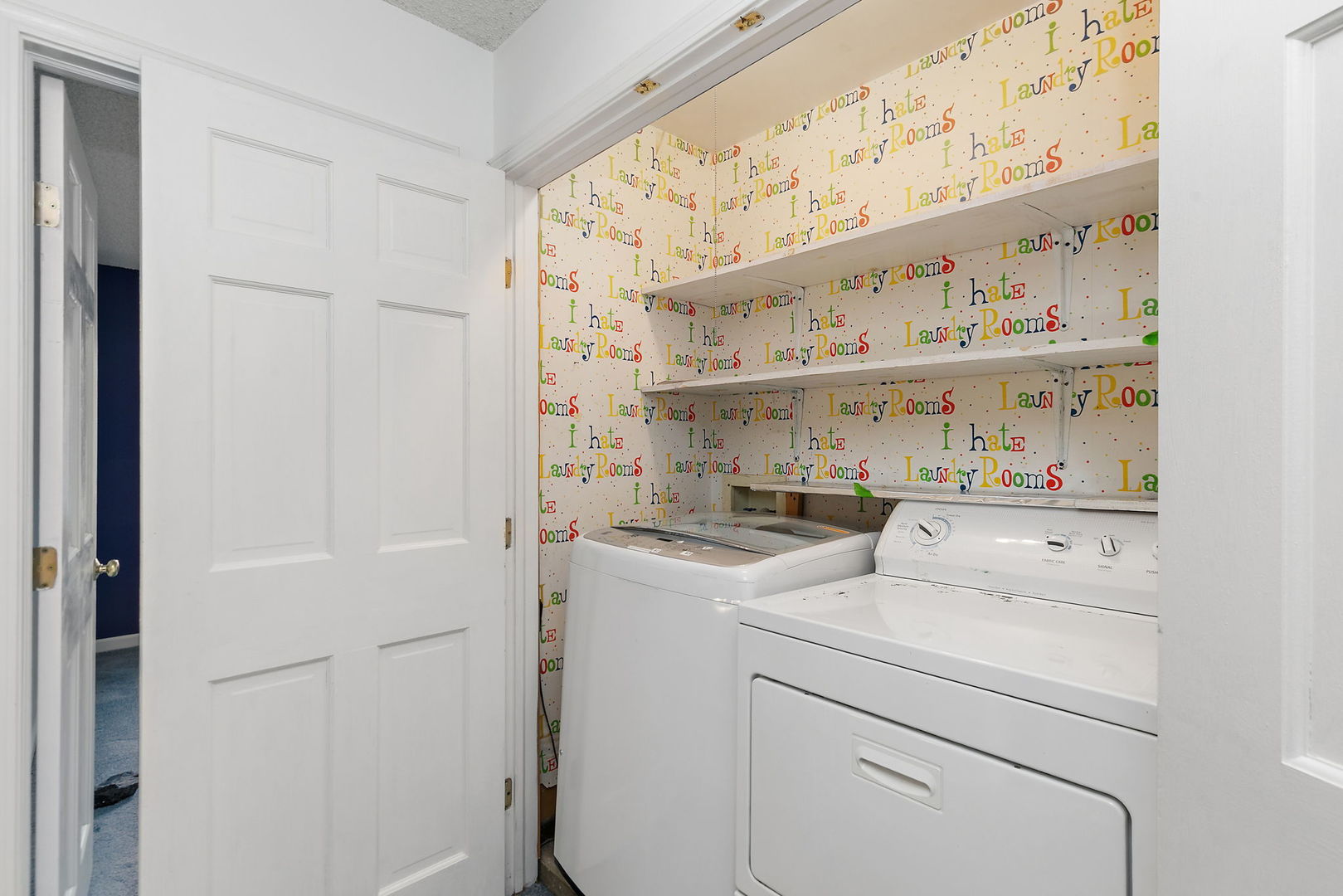517 Sheffield Road Naperville, IL 60565 - Photo 17 of 29 a view of washer and dryer with kitchen in the background