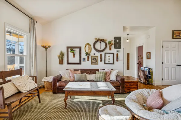 a bedroom with furniture and wooden floor