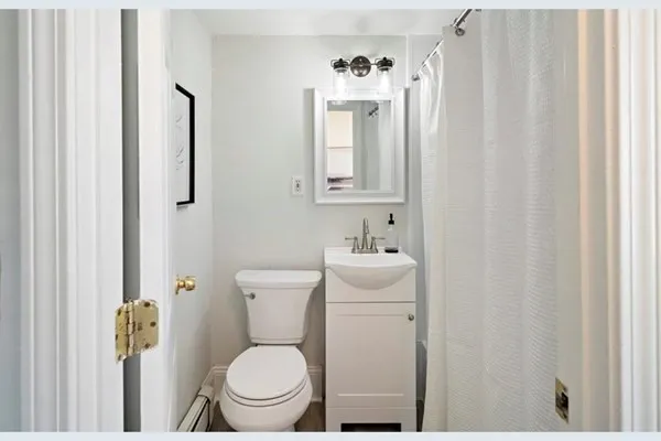 a bathroom with a toilet and a sink