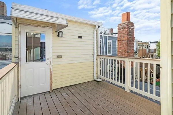 a view of balcony with wooden floor