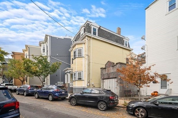264 Webster Street, Unit 3A Boston, MA 02128 - Photo 22 of 22 a view of cars parked in front of a house