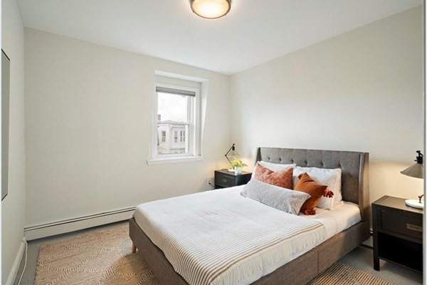 264 Webster Street, Unit 3A Boston, MA 02128 - Photo 10 of 22 a bedroom with a bed and a window