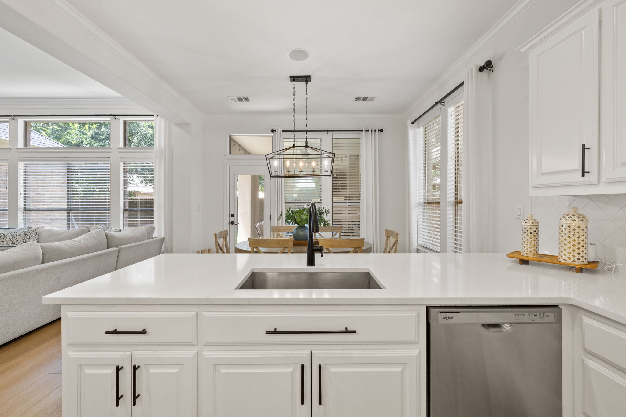 1124 Castle Path Round Rock, TX 78681 - Photo 17 of 40 A well-appointed kitchen island with sleek counters anchors this open-concept living space.