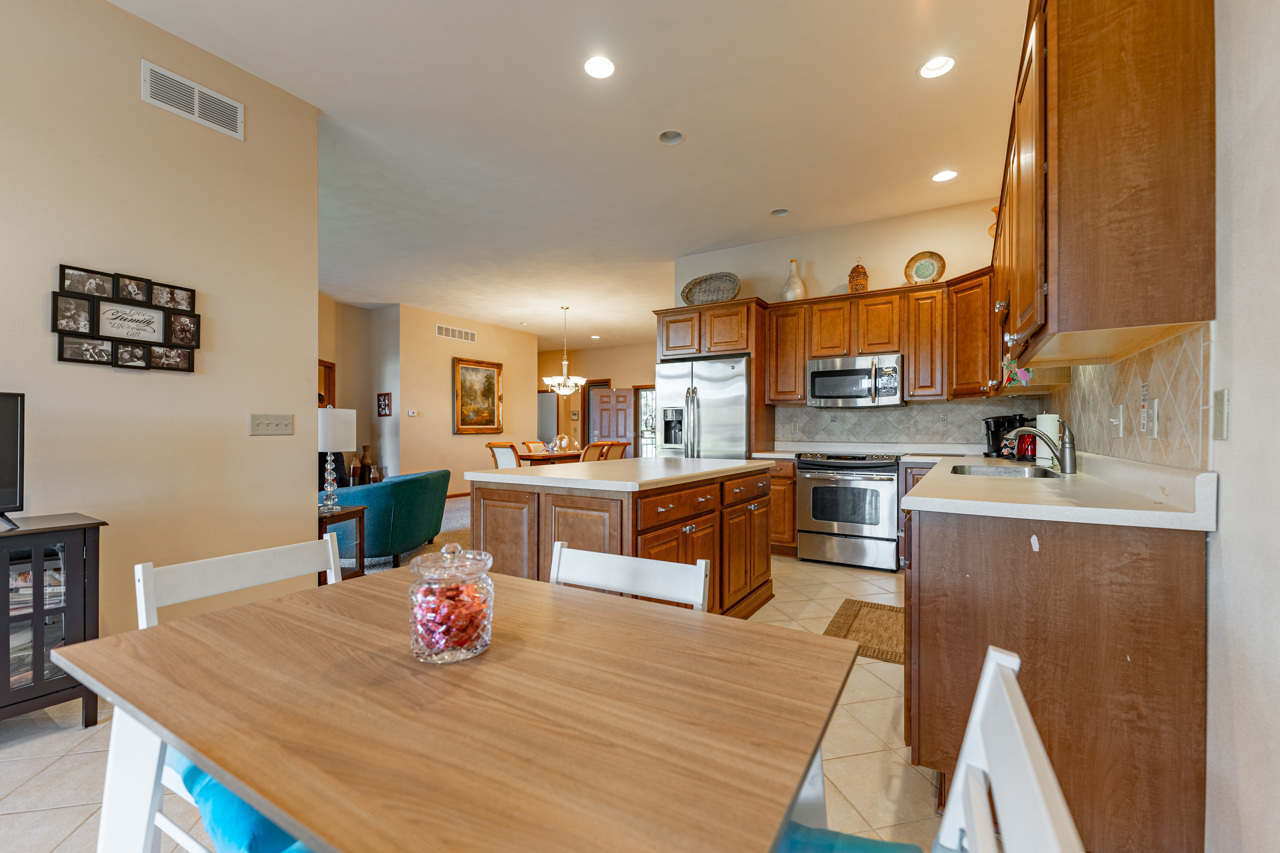 5624 Spring Brook Road, Unit 5624 Rockford, IL 61114 - Photo 13 of 34 a kitchen with a sink appliances and cabinets
