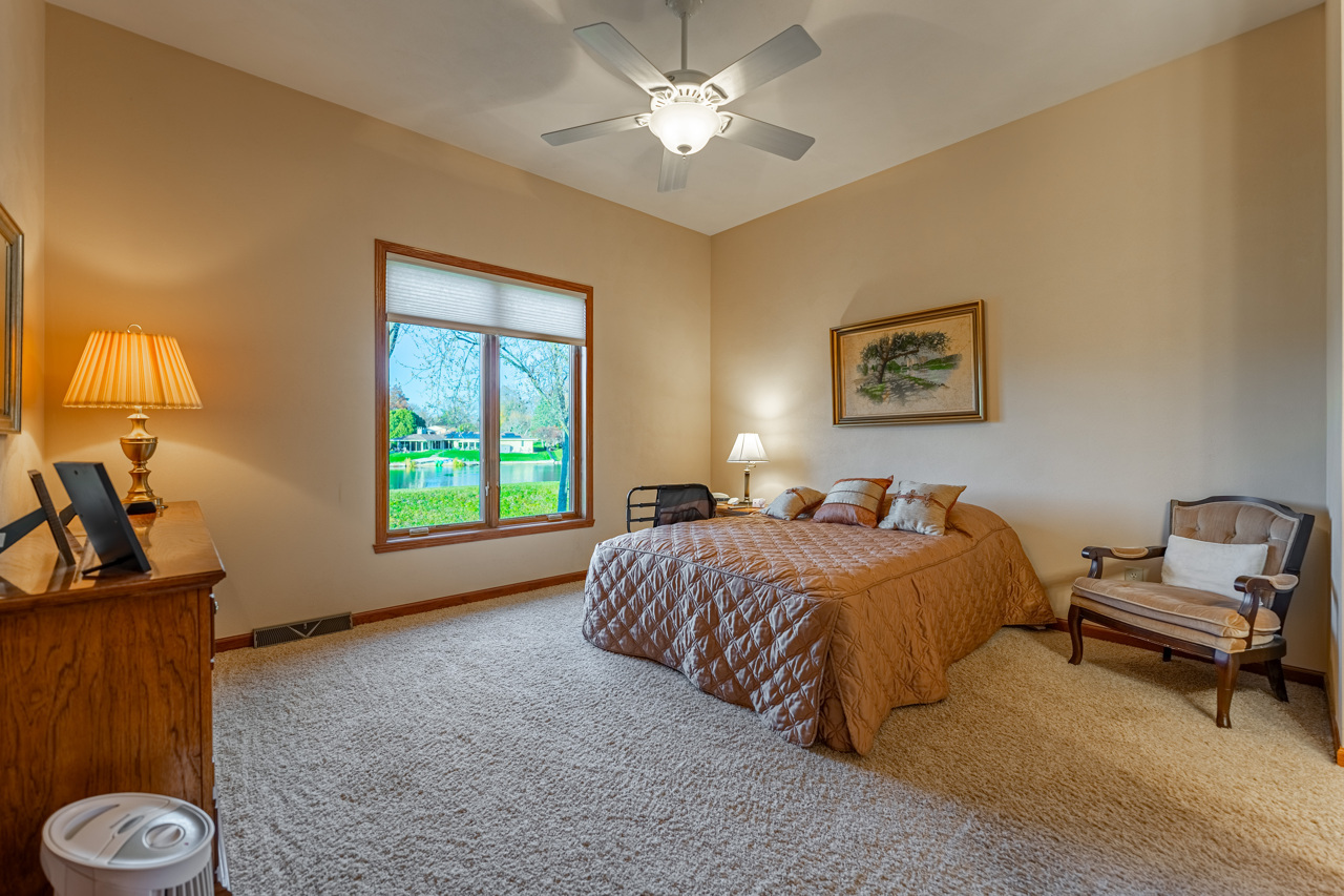 5624 Spring Brook Road, Unit 5624 Rockford, IL 61114 - Photo 14 of 34 a bed room with a bed and a window