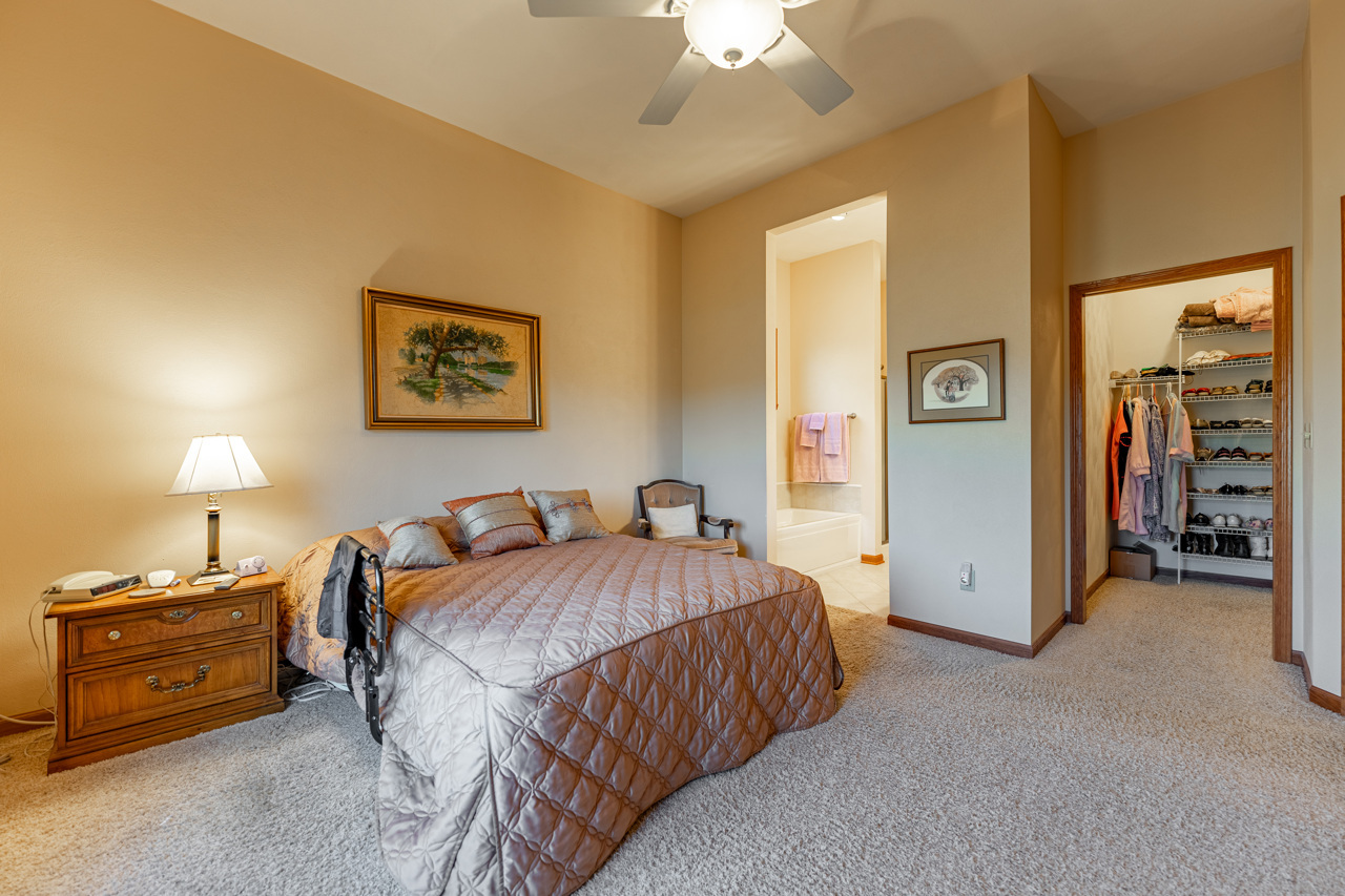 5624 Spring Brook Road, Unit 5624 Rockford, IL 61114 - Photo 15 of 34 a spacious bedroom with a bed and a cabinets