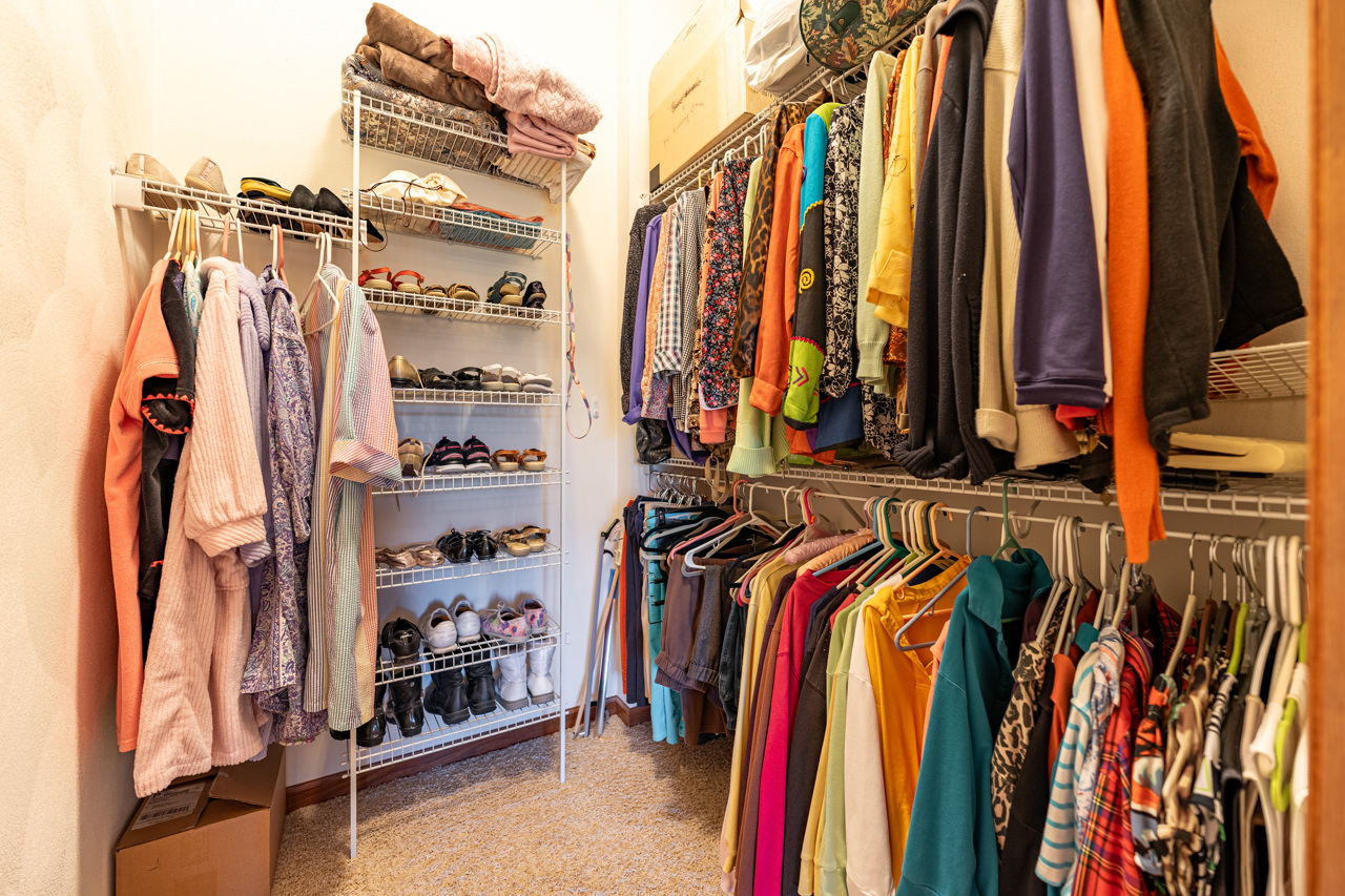 5624 Spring Brook Road, Unit 5624 Rockford, IL 61114 - Photo 18 of 34 a view of walk in closet with clothes and shoes