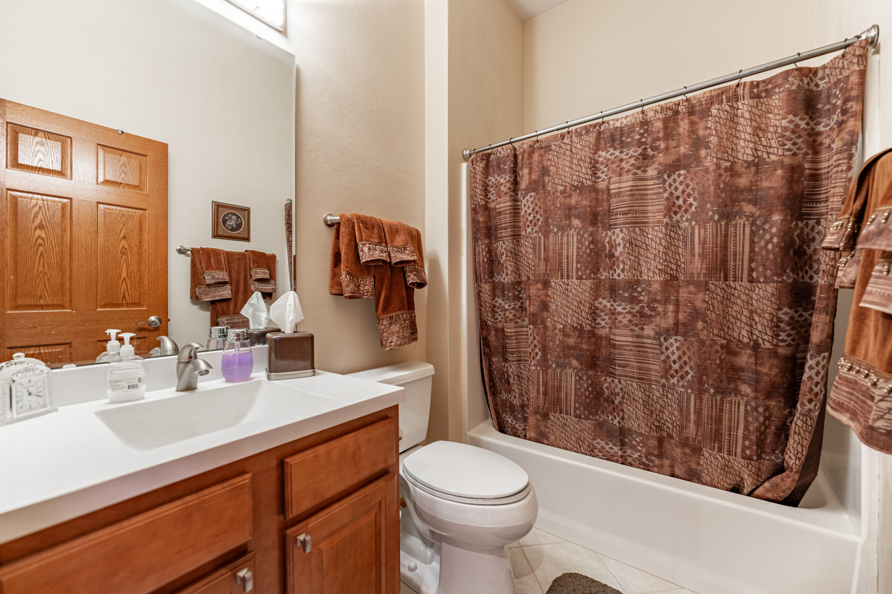 5624 Spring Brook Road, Unit 5624 Rockford, IL 61114 - Photo 21 of 34 a bathroom with a sink toilet and shower