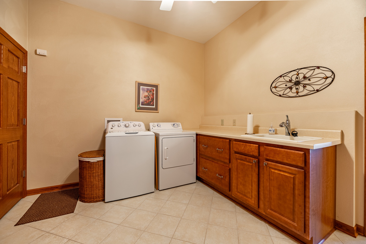 5624 Spring Brook Road, Unit 5624 Rockford, IL 61114 - Photo 23 of 34 a utility room with a sink a washer and dryer