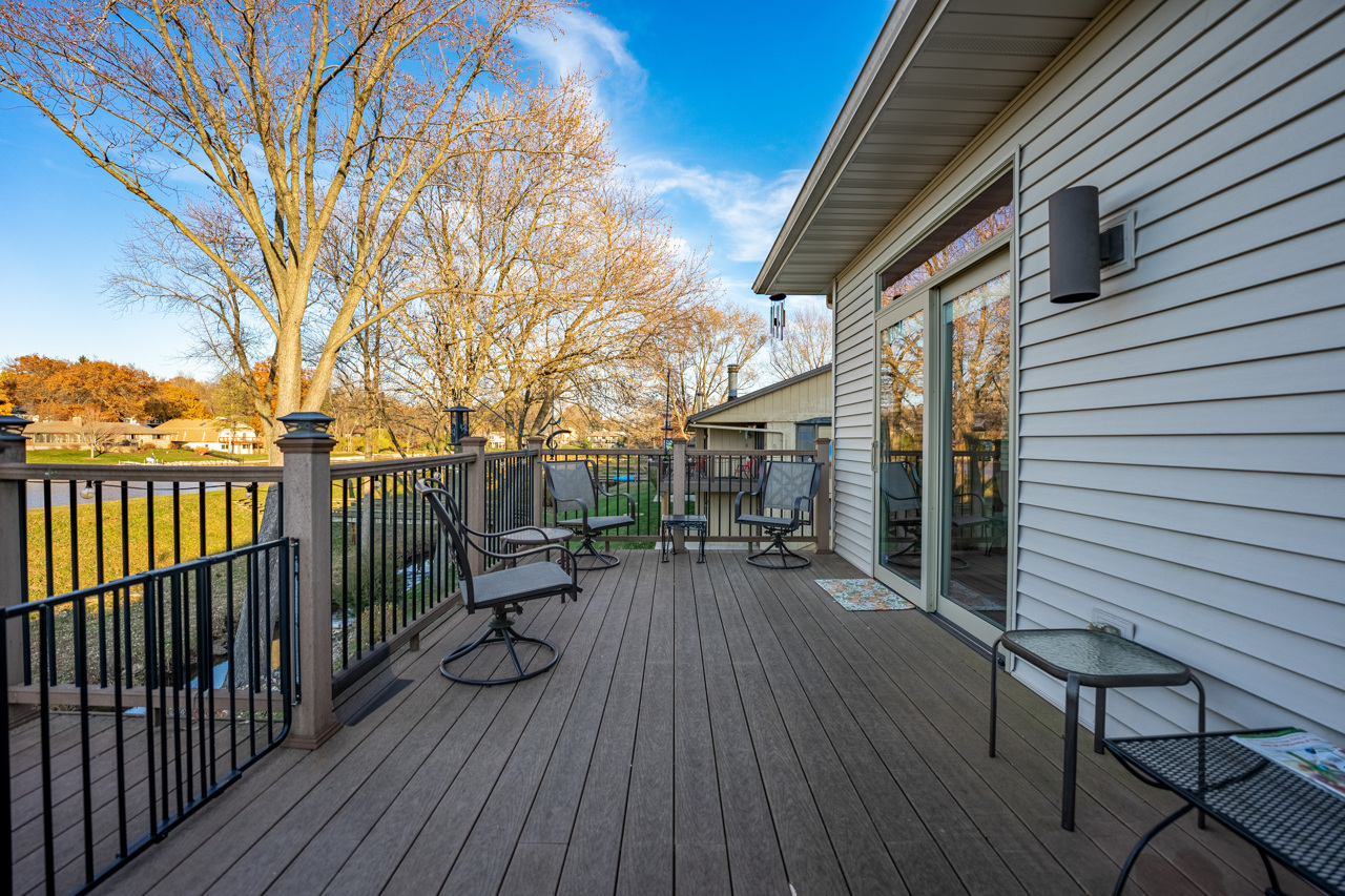 5624 Spring Brook Road, Unit 5624 Rockford, IL 61114 - Photo 28 of 34 a view of couches on the deck with wooden floor