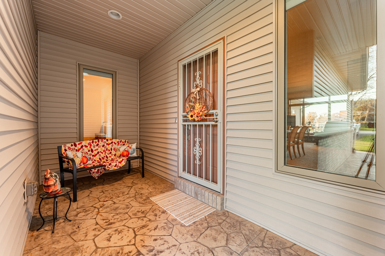 5624 Spring Brook Road, Unit 5624 Rockford, IL 61114 - Photo 4 of 34 a balcony with painting and a rug