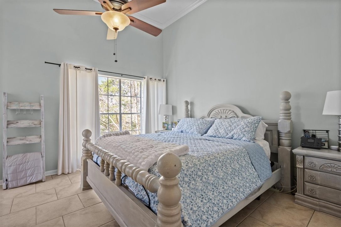 2903 Lake Shore Drive, Unit 303 Waco, TX 76708 - Photo 14 of 29 a bedroom with a bed and a chandelier
