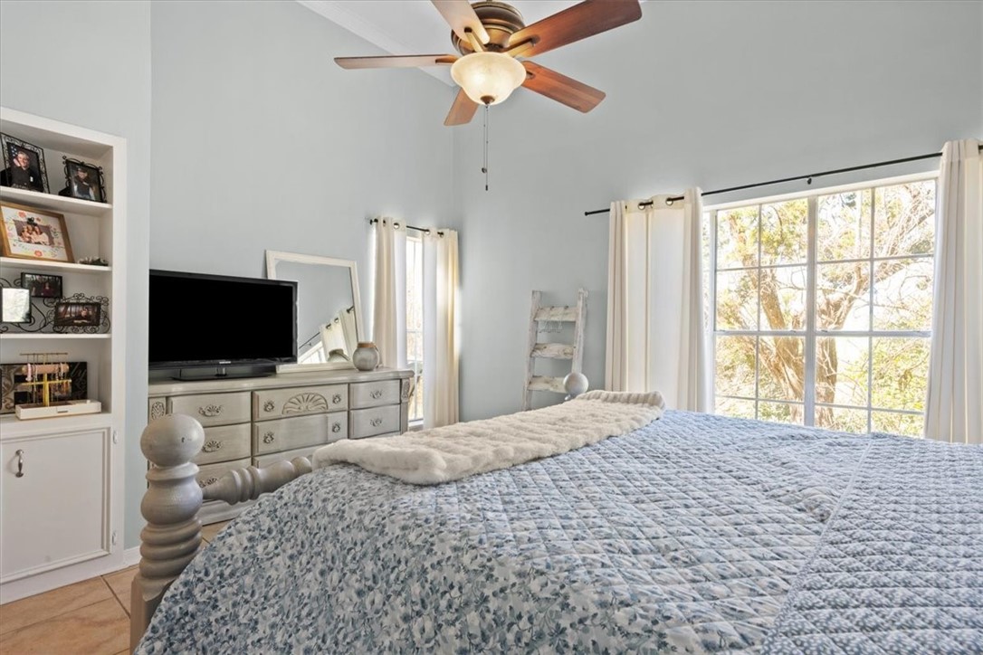 2903 Lake Shore Drive, Unit 303 Waco, TX 76708 - Photo 17 of 29 a bedroom with a bed and a flat screen tv