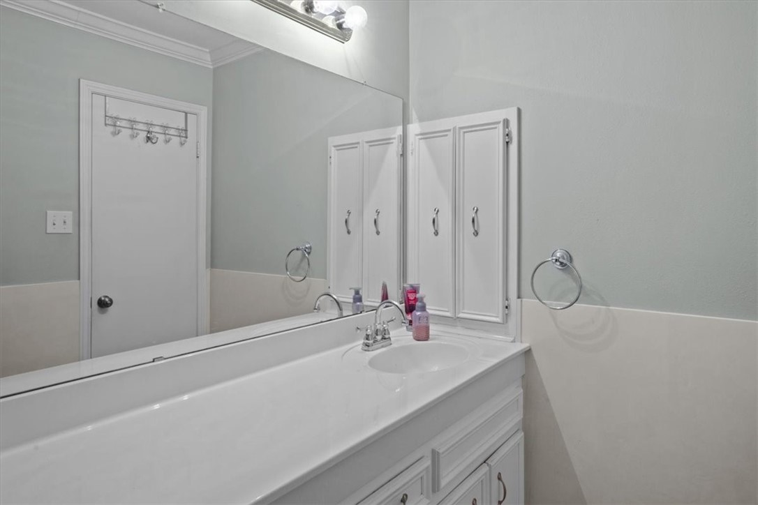 2903 Lake Shore Drive, Unit 303 Waco, TX 76708 - Photo 19 of 29 a bathroom with a sink vanity and tub