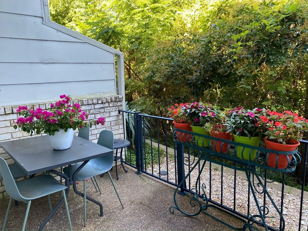 2903 Lake Shore Drive, Unit 303 Waco, TX 76708 - Photo 29 of 29 a view of a chairs and table in the patio with a barbeque