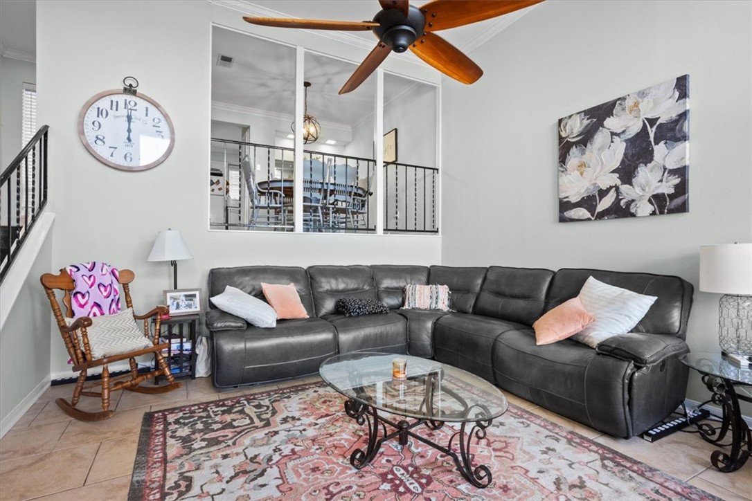 2903 Lake Shore Drive, Unit 303 Waco, TX 76708 - Photo 5 of 29 a living room with furniture a rug and a wall painting