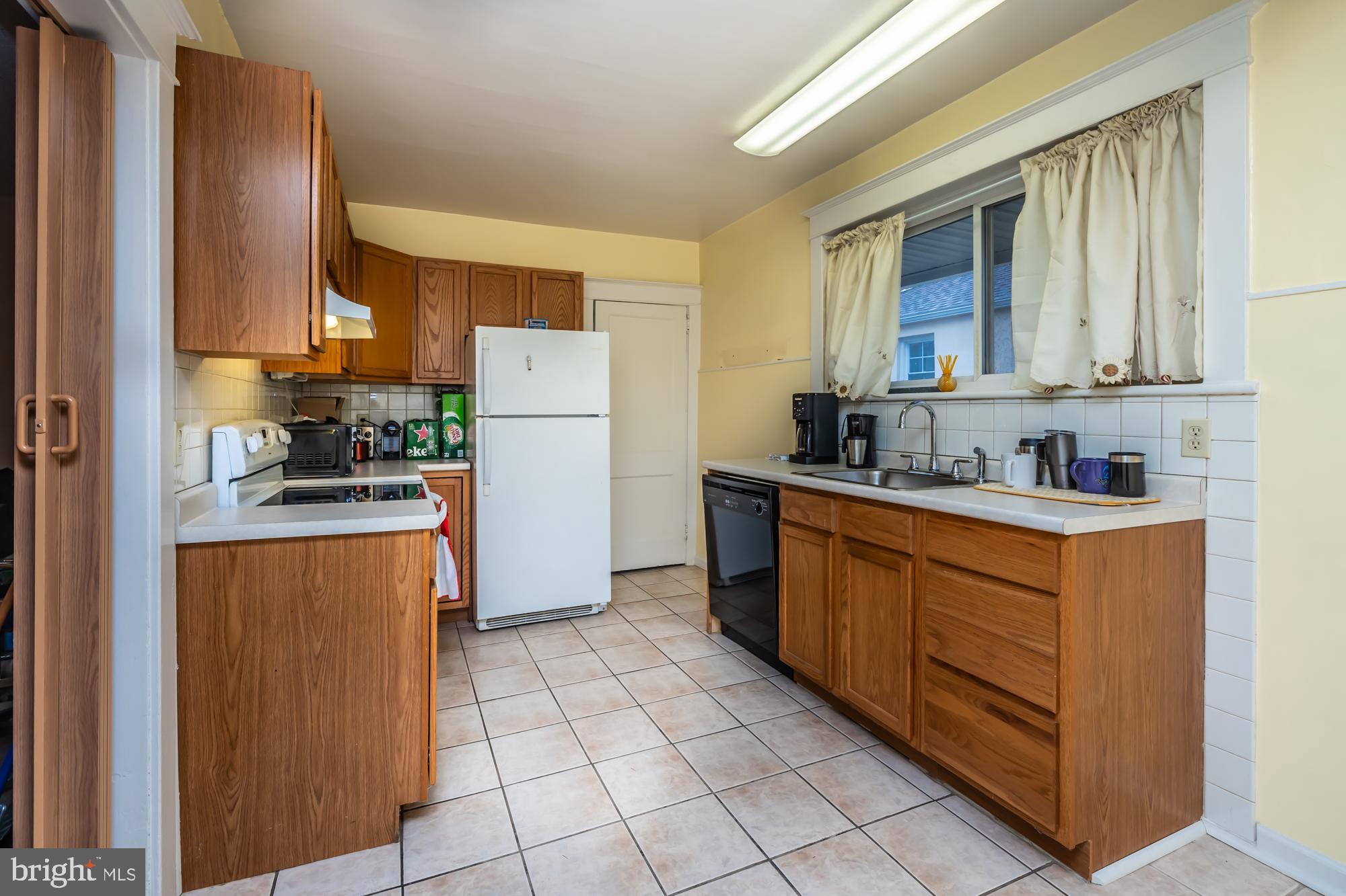 3601 State Road Drexel Hill, PA 19026 - Photo 11 of 32 a kitchen with stainless steel appliances granite countertop a refrigerator and a sink
