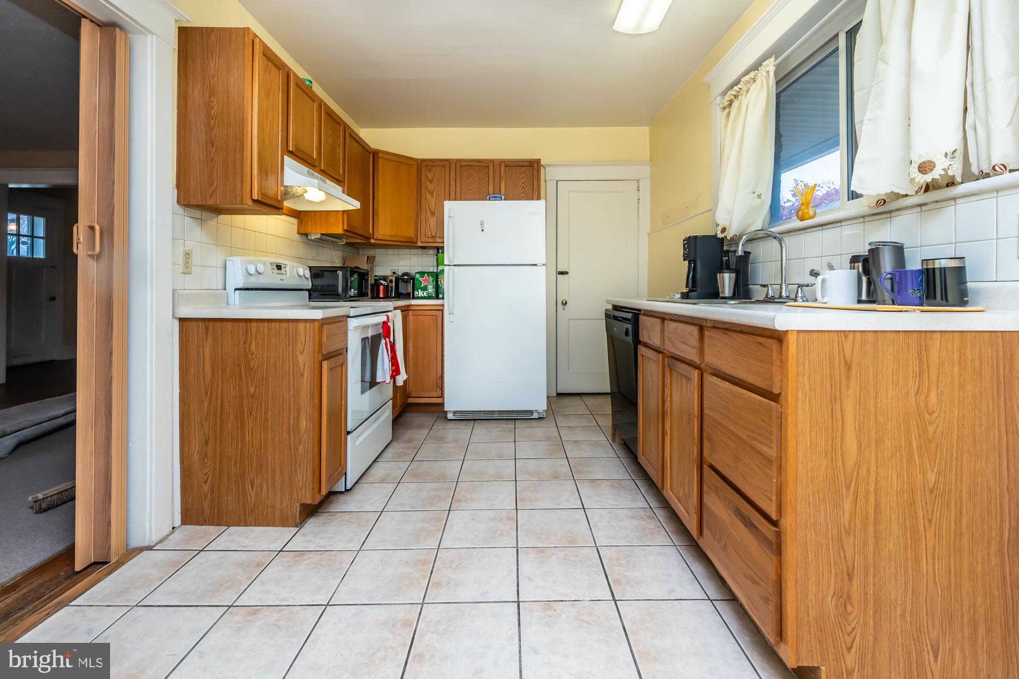 3601 State Road Drexel Hill, PA 19026 - Photo 12 of 32 a kitchen with stainless steel appliances granite countertop a refrigerator and a stove top oven