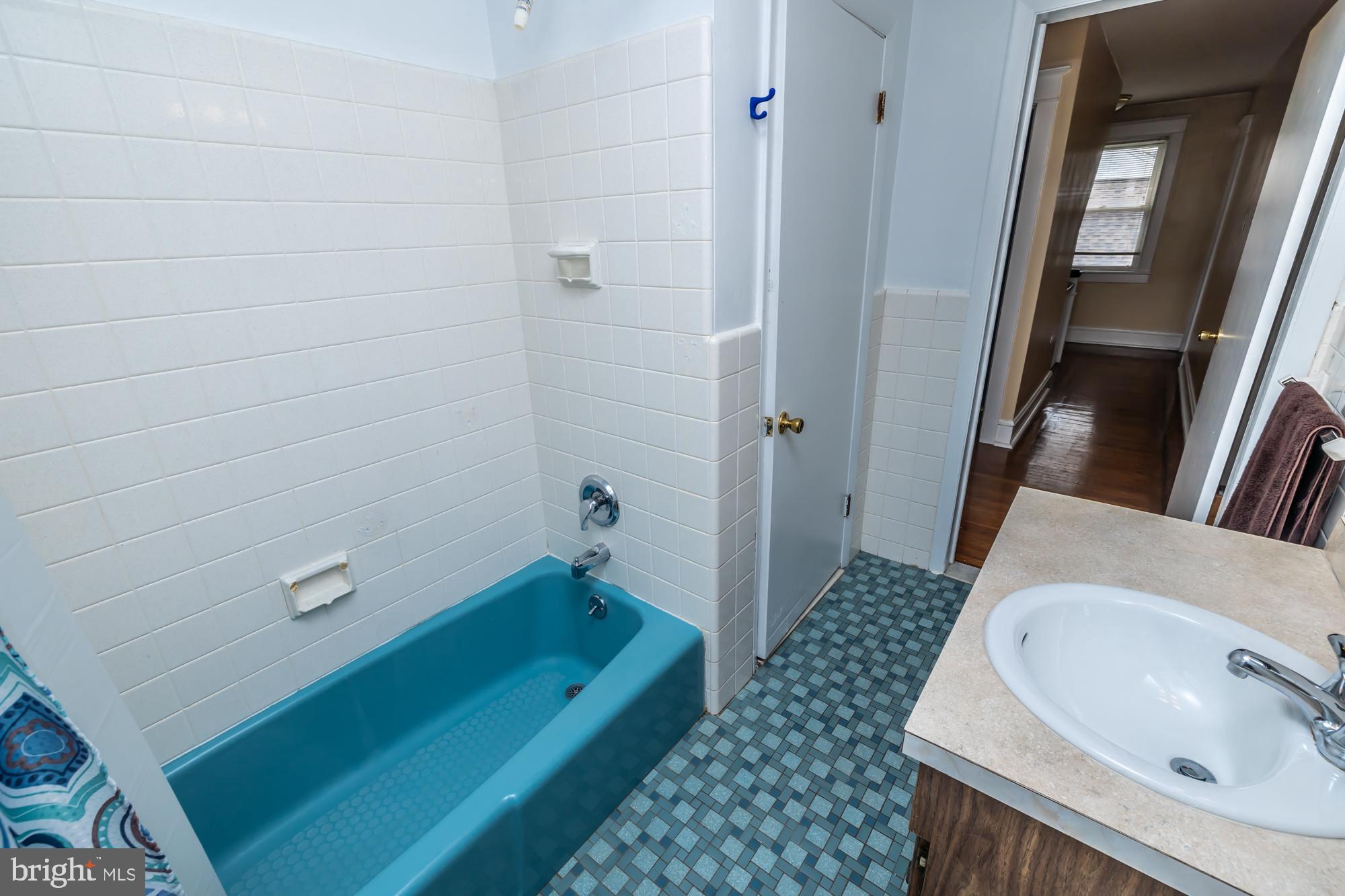 3601 State Road Drexel Hill, PA 19026 - Photo 21 of 32 a bathroom with a sink a toilet a mirror and shower