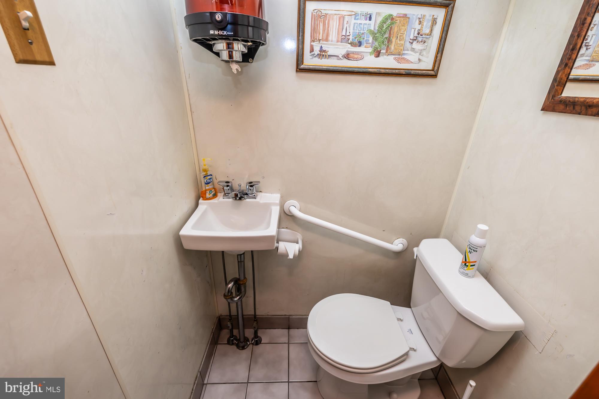 3601 State Road Drexel Hill, PA 19026 - Photo 32 of 32 a bathroom with a toilet a sink and mirror