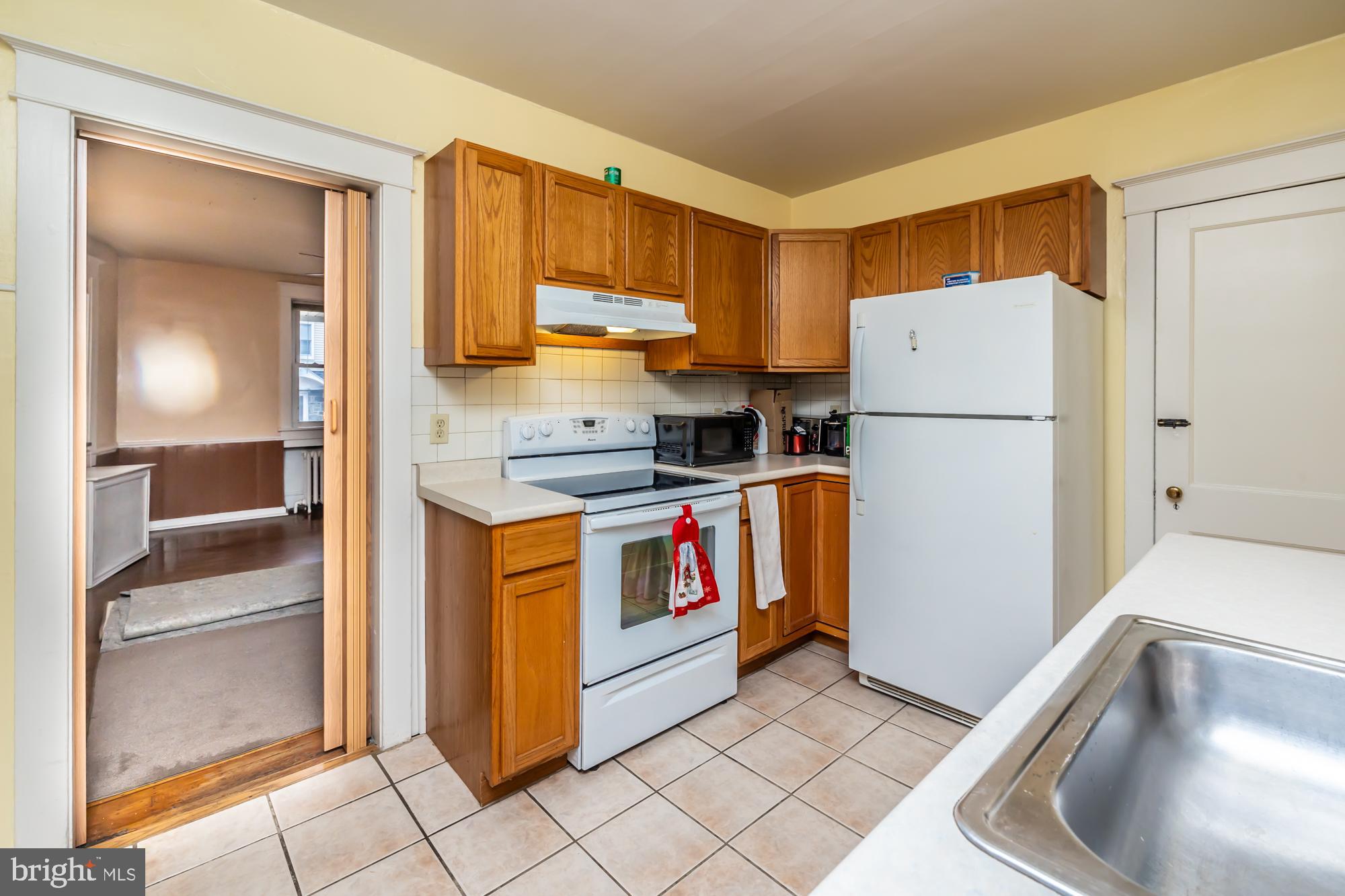 3601 State Road Drexel Hill, PA 19026 - Photo 6 of 32 a kitchen with refrigerator and cabinets