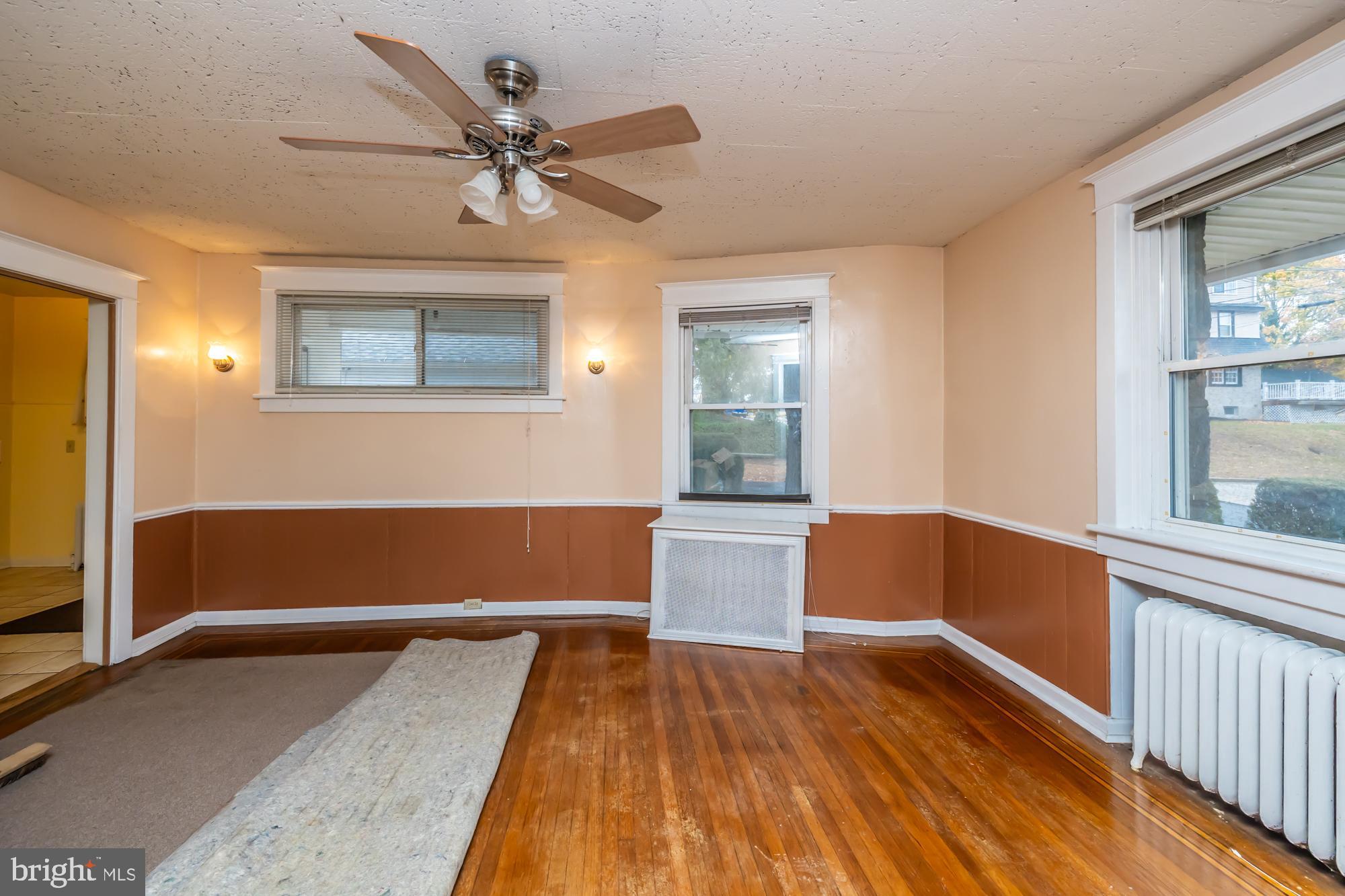 3601 State Road Drexel Hill, PA 19026 - Photo 9 of 32 a living room with wooden floor and a window