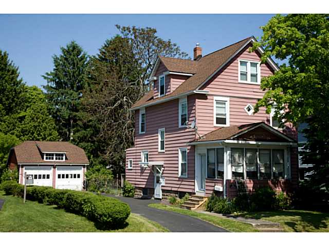 121 Kansas Street Rochester, NY 14609 - Photo 1 of 1 Exterior Front. The yard extends behind the garage