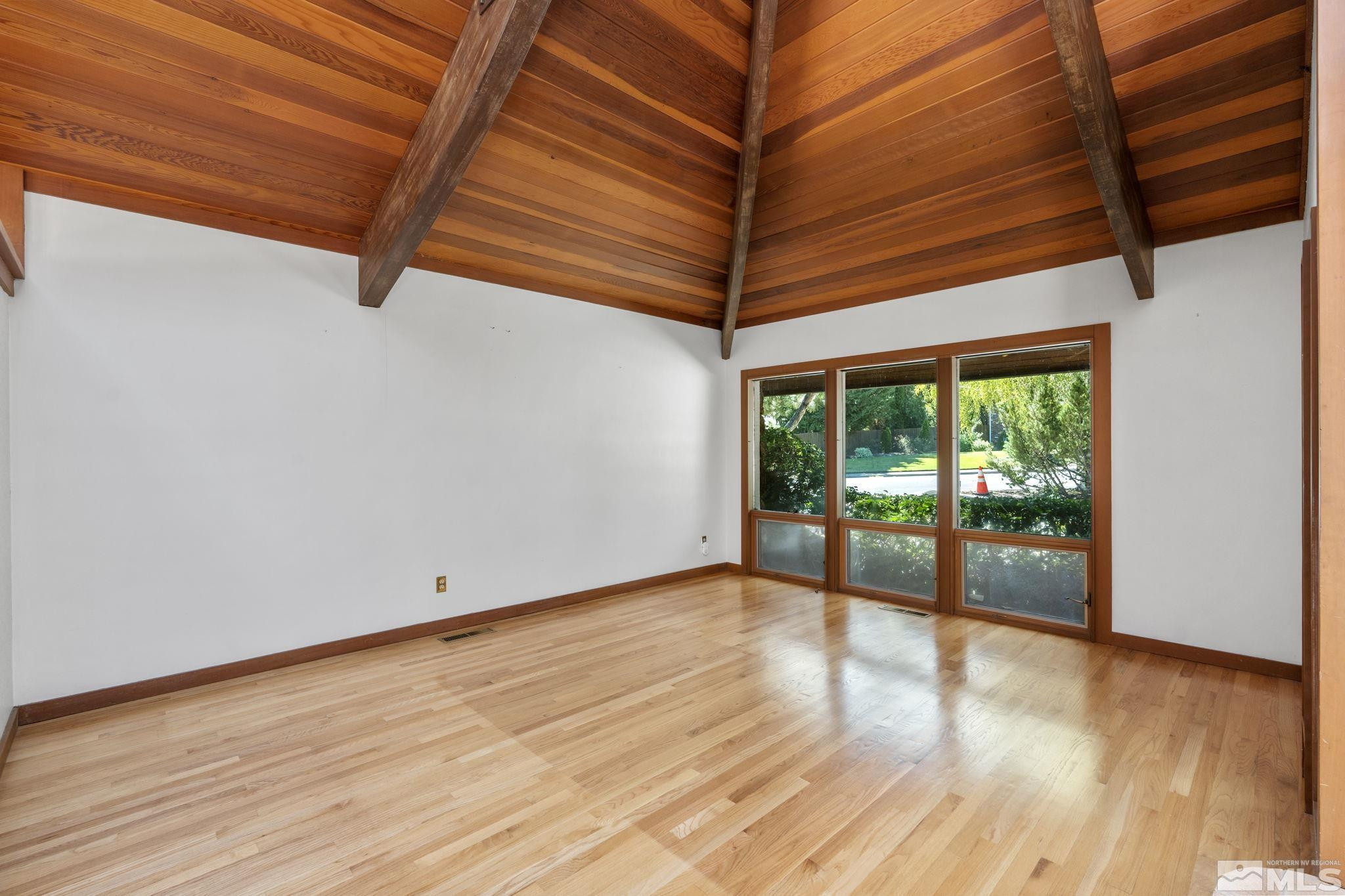 1575 Webster Way Reno, NV 89509 - Photo 12 of 40 a view of an empty room with wooden floor and a window