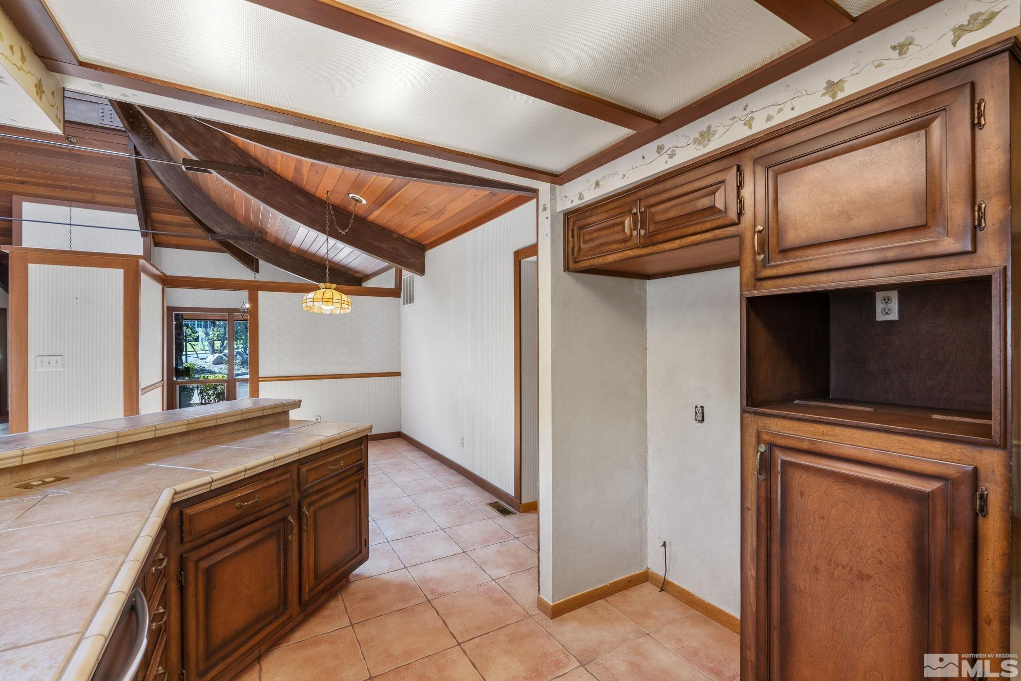 1575 Webster Way Reno, NV 89509 - Photo 15 of 40 a view of a refrigerator and window in the room