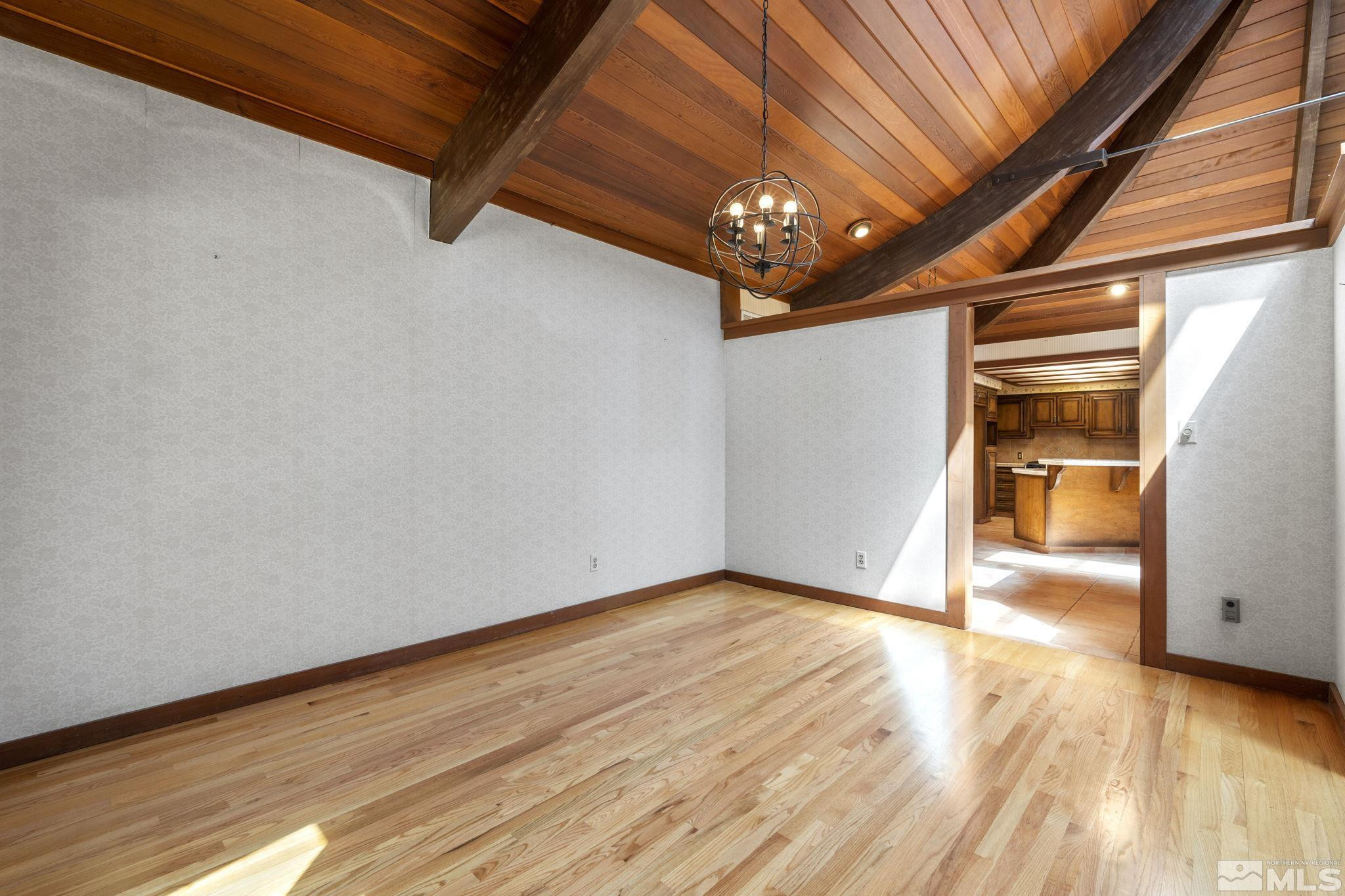 1575 Webster Way Reno, NV 89509 - Photo 21 of 40 a view of an empty room with wooden floor