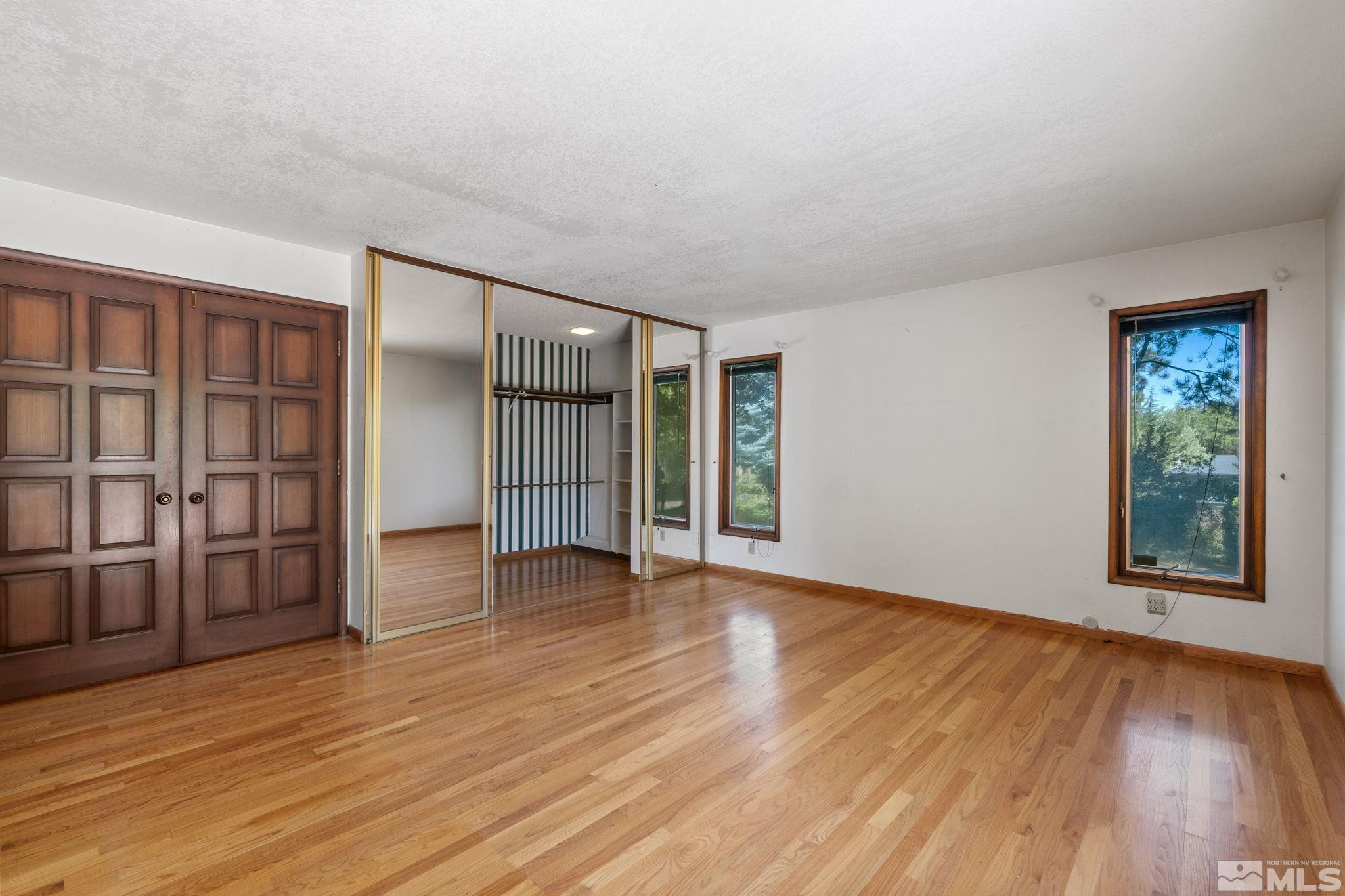 1575 Webster Way Reno, NV 89509 - Photo 24 of 40 a view of an empty room with wooden floor and a window