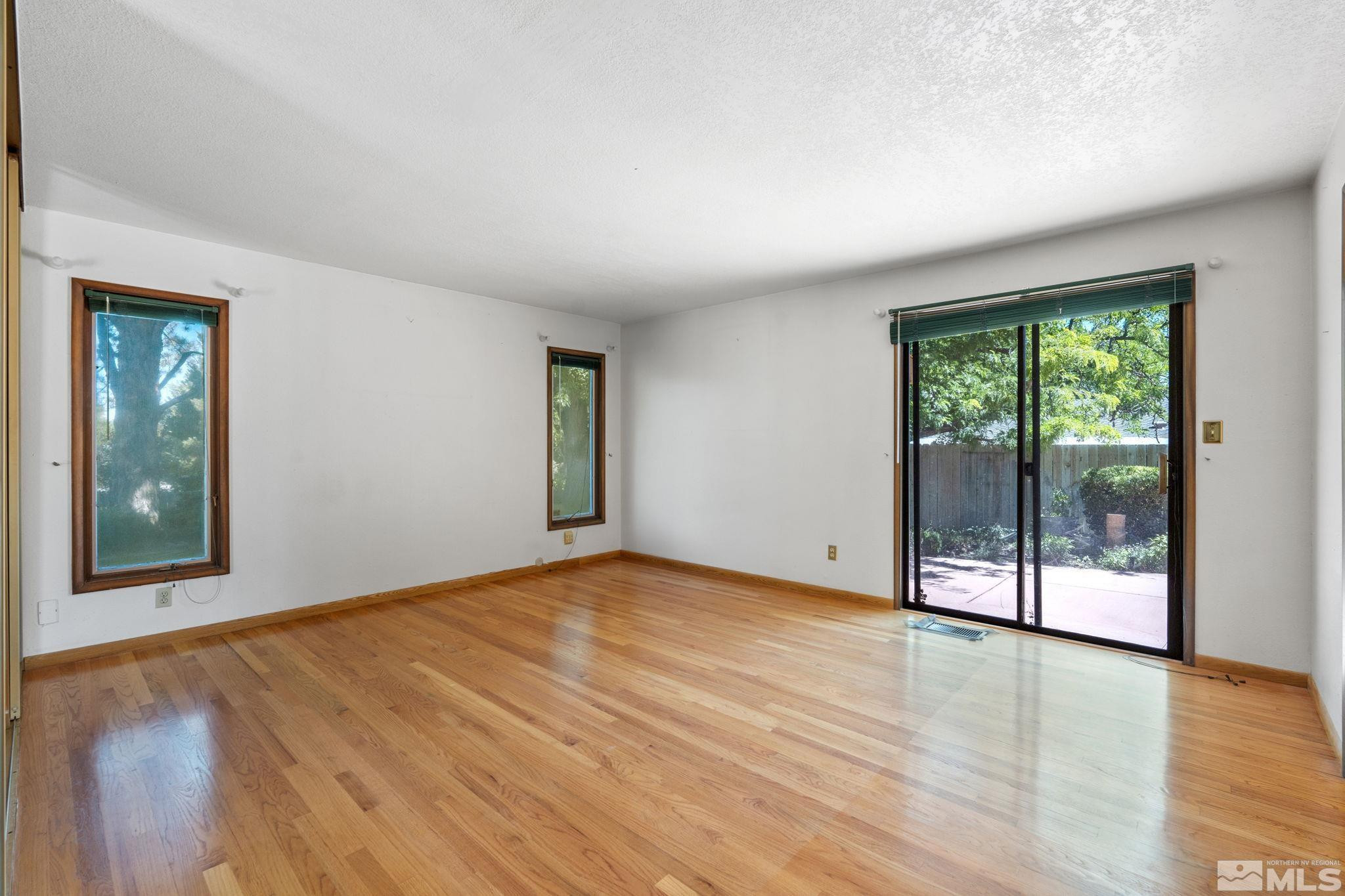 1575 Webster Way Reno, NV 89509 - Photo 25 of 40 a view of an empty room with wooden floor and a window